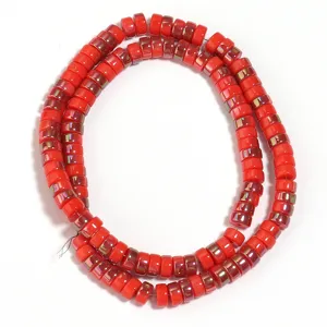 Detailed shot of vibrant red electroplated glass spacer beads, perfect for DIY jewelry making.
