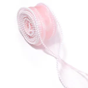 Delicate pink sheer organza ribbon with white pearl edge for gift wrapping, bouquet and craft decor.