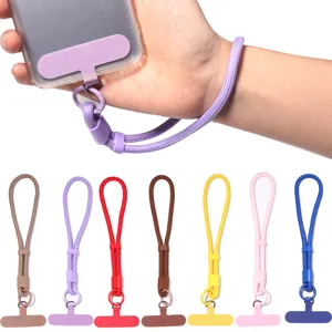 Verstelbaar polyester polsbandje voor telefoon met bevestiging, kleurrijke details.