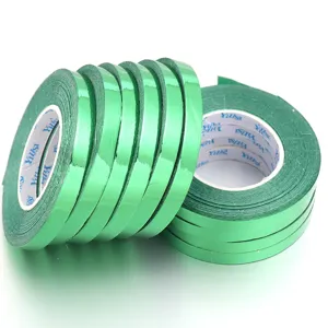 Green metallic ribbon rolls for balloon wrapping, gift packaging, and party decorations.
