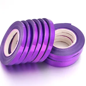 Close-up detail of glossy purple metallic ribbon rolls, perfect for gift wrapping and decor.