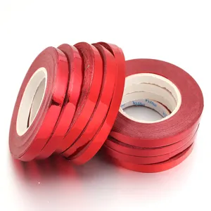 Red metallic ribbon rolls for gift wrapping, balloon string, wedding party and holiday decoration.