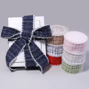 Detailed close-up shot of tweed fabric ribbons and decorative bows in various plaid colors.