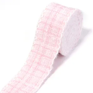 Pink tweed ribbon trim detail featuring classic grid pattern and delicate white scalloped edge.