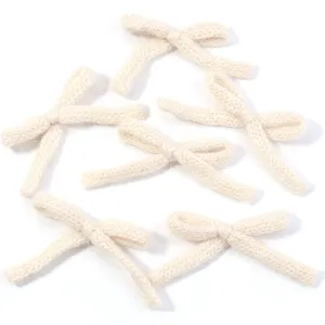 Knitted bow detail shot, cute DIY cotton accessory for clothing, shoes, hats, and hair clips.