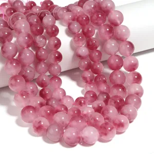 Perline di calcedonio rosa dettaglio, pietra rotonda liscia per accessori gioielli.