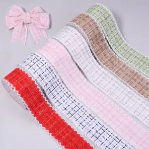 Multicolor tweed fabric ribbon rolls and cute matching bow for DIY clothing crafts and hair accessories.