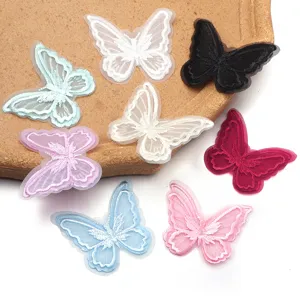 Detailed view of colorful 3D lace butterfly embroidery patches for DIY clothing and crafts.