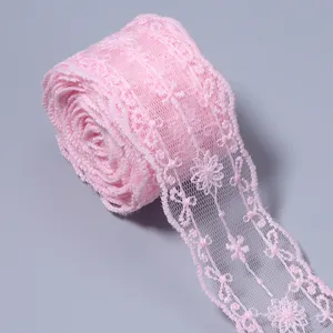 Pink lace trim detail shot, soft mesh embroidery for DIY doll clothes and craft accents.
