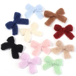 Knitted mesh bow detail shot, colorful handmade wool DIY clothing accessories.