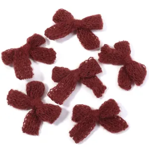 Handmade knitted double layer wool bow accessories for DIY hair clips and clothing decor.