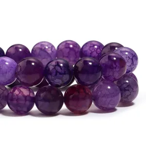Close up detail shot of purple dragon vein agate round beads for DIY jewelry making.