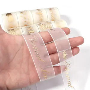 Goldfolien Transparente Band Detailansicht mit Eternal Love Text und Mustern für Geschenke.