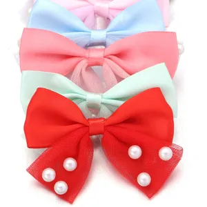 Close-up of colorful mesh hair bow details with pearl embellishments for DIY crafts accessories.