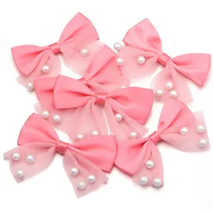 Pink double-layer mesh bow embellishment detail, cute hair clip and garment DIY accessory.