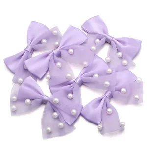 Wholesale lavender mesh bow pearl DIY accessories for hair clips and clothing decor.
