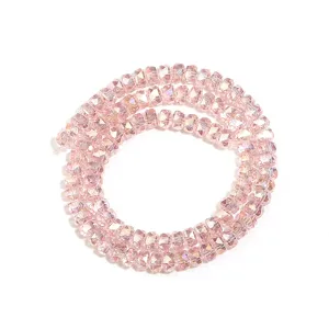 Close-up detail of light pink faceted crystal rondelle spacer beads for DIY jewelry making.