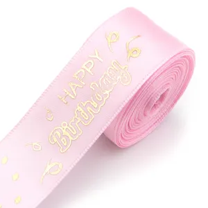 Pink satin ribbon roll with gold happy birthday print for gift wrapping and party decor