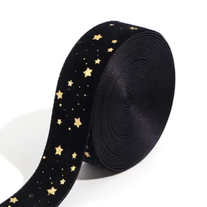 Black velvet ribbon with gold stars detail for DIY bows, gift wrapping and holiday crafts.