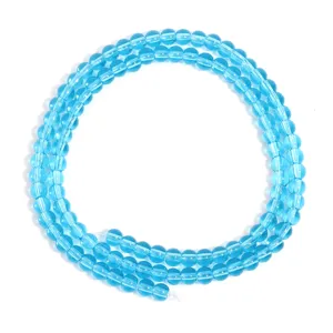 Transparent blue glass loose beads detail shot for DIY crafts and jewelry making.