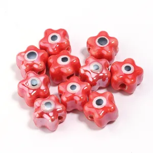 Rode keramieken bloem boze oog kralen variante voor handgemaakte DIY armbanden en sieraden.