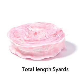 Detail shot of pink plaid pleated ribbon roll, soft texture, perfect for DIY bows and wrapping.