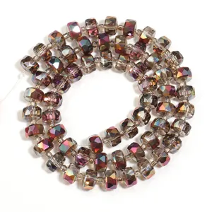Detailed shot of faceted rondelle crystal spacer beads with multi-color metallic AB finish.