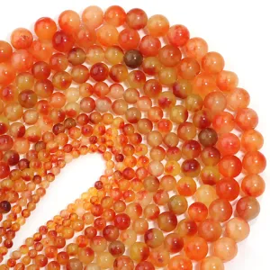 Perle sfuse rotonde in agata corniola naturale per la creazione di gioielli e braccialetti fai da te.