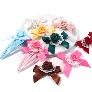Close-up of colorful ribbon rose hair clips with delicate lace trim, perfect for cute hair styling.