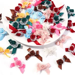 Detailed view of colorful ribbon rose bows with lace trim, perfect for DIY crafts and accessories.