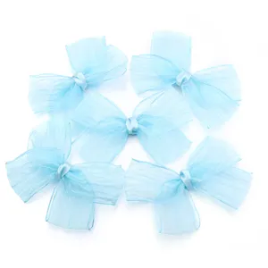 Light blue pleated organza ribbon bow, detailed view of craft and accessory design.