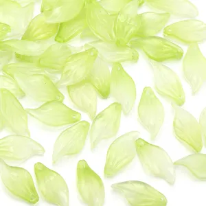 Close up of translucent green glass leaf beads, exquisite DIY jewelry making charm accessories.