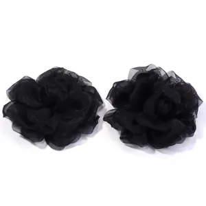 Detailed view of two black mesh fabric rose flower accessories for DIY crafts, apparel, and hair.