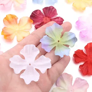 Detail view of colorful four-petal fabric flower patches, perfect for DIY handmade crafts.