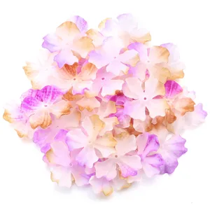 Close-up details of gradient purple and pink artificial 4-petal fabric DIY craft flower pieces.