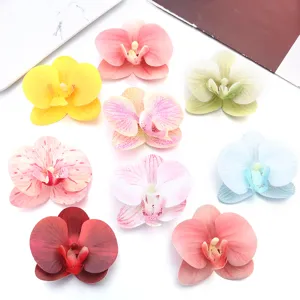 Artificial fabric phalaenopsis orchid flower heads for DIY wedding and home decor.