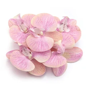 Artificial pink phalaenopsis orchid flower heads for wedding home decor and DIY hair accessories.