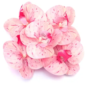 Artificial pink phalaenopsis orchid flowers for home decor, wedding walls, and hair clips.