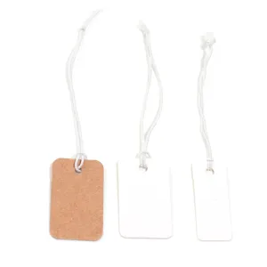 Blank price tags with elastic strings, kraft paper and white tags for retail jewelry items.