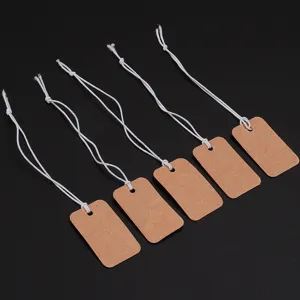 Blank craft paper price tags with white elastic strings for jewelry, clothing and retail display.