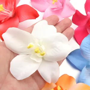 Close up view of artificial fabric flower petals and yellow stamen details for crafts.
