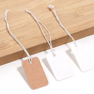 Blank paper hang tags with white elastic string for jewelry, clothing, gift pricing and display.