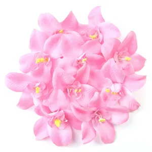 Pink artificial silk orchid flower heads, ideal for wedding flower walls and home decor.