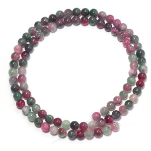 Perle tonde in pietra naturale colorata ideali per la produzione di accessori per gioielli fai da te.