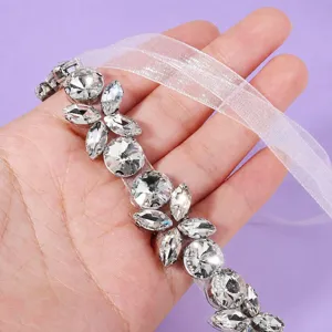 Elegant rhinestone bridal belt with sheer ribbon, sparkling crystal waist accessory for party.