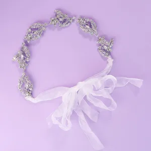 Sparkling silver rhinestone bridal hair vine with white ribbon for wedding party headwear.