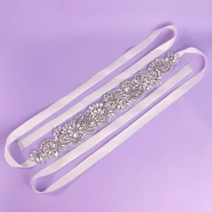 Stunning rhinestone bridal belt with sparkling crystals and white satin ribbon for weddings.