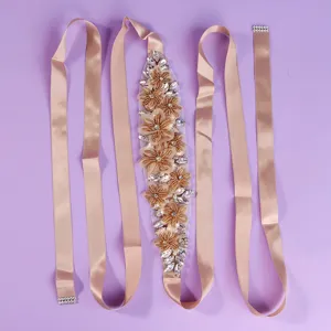 Elegant bridal rhinestone satin belt, featuring floral embroidery and long ribbons for weddings.