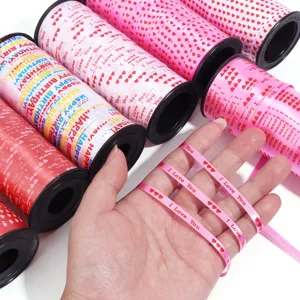 Colorful printed ribbon rolls with heart patterns, ideal for party and gift wrapping decorations.
