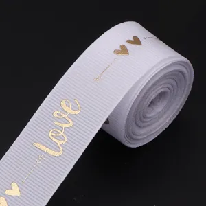 White polyester ribbon with gold foil love and heart print for gift box decoration and craft.